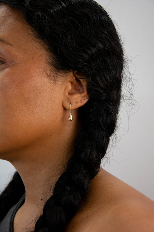 Solid 14k gold drop charm earrings handmade in Asheville, NC.