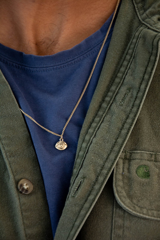 Solid 14k eye charm necklace handmade in Asheville, NC.