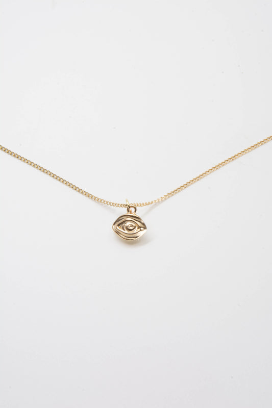 Solid 14k eye charm necklace handmade in Asheville, NC.