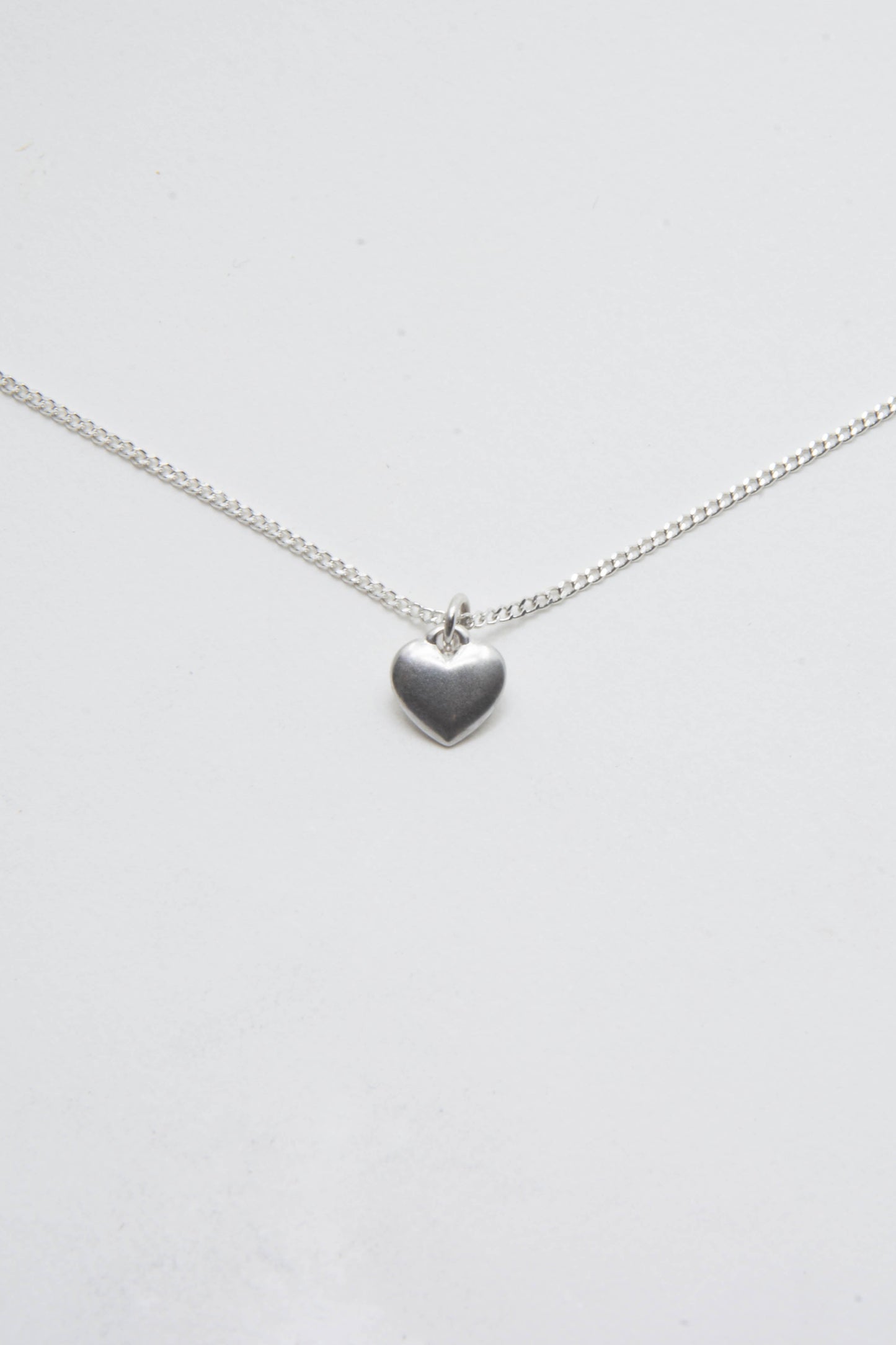 Solid sterling silver 925 heart charm necklace handmade in Asheville NC.