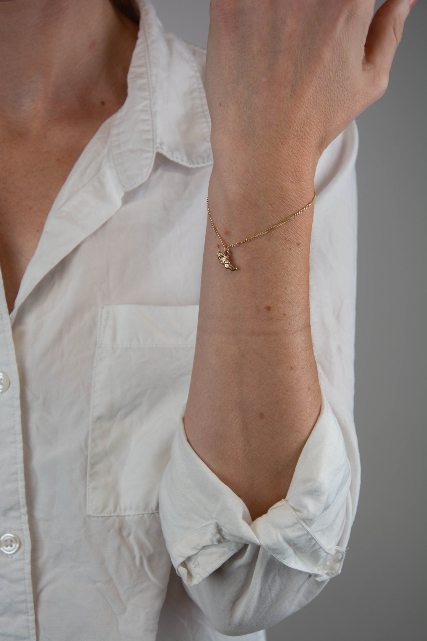 Solid 14k gold curbed chain Hermes charm bracelet handmade in Asheville, NC.
