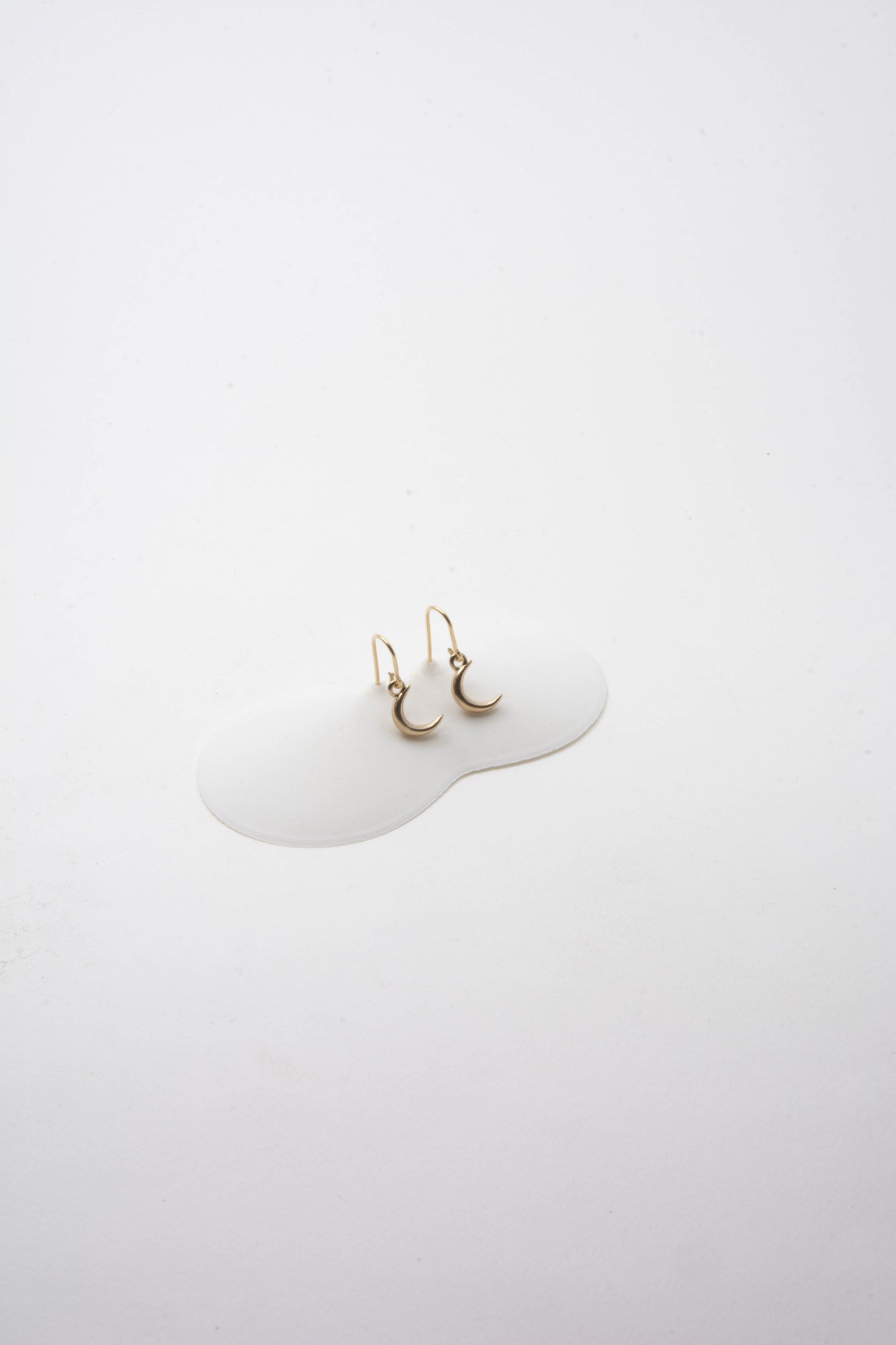 Solid 14k gold crescent moon charm earrings handmade in Asheville, NC.