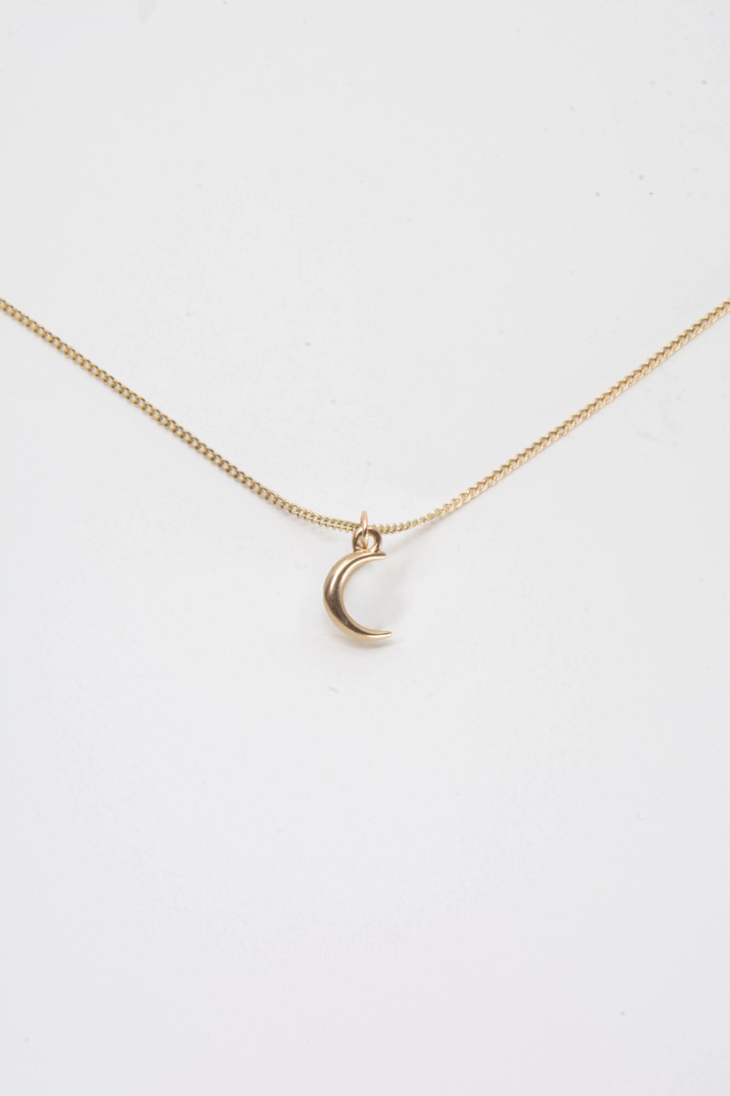 Solid 14k crescent moon charm necklace handmade in Asheville, NC.