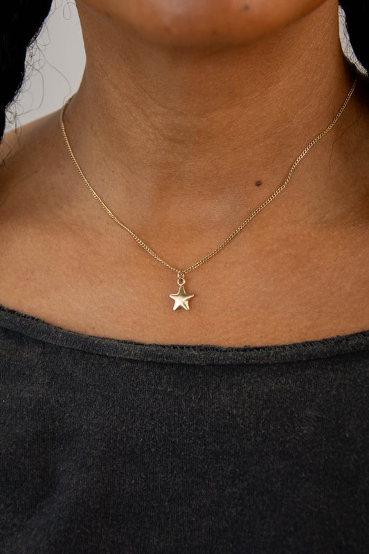 Solid 14k star charm necklace handmade in Asheville, NC.