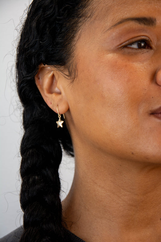 Solid 14k heart charm earrings handmade in Asheville, NC.