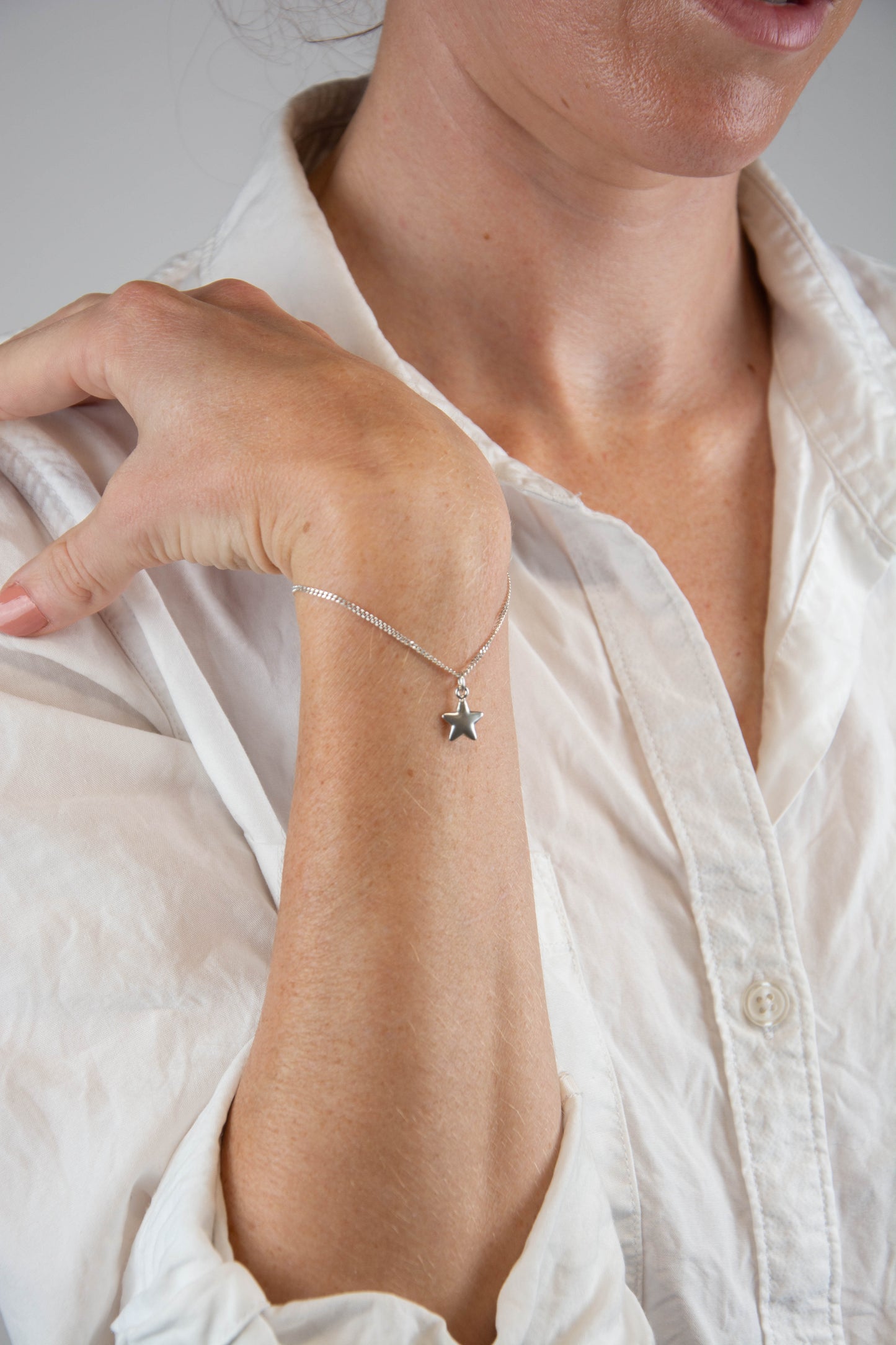 Solid sterling silver 925 curbed chain star charm bracelet handmade in Asheville, NC.