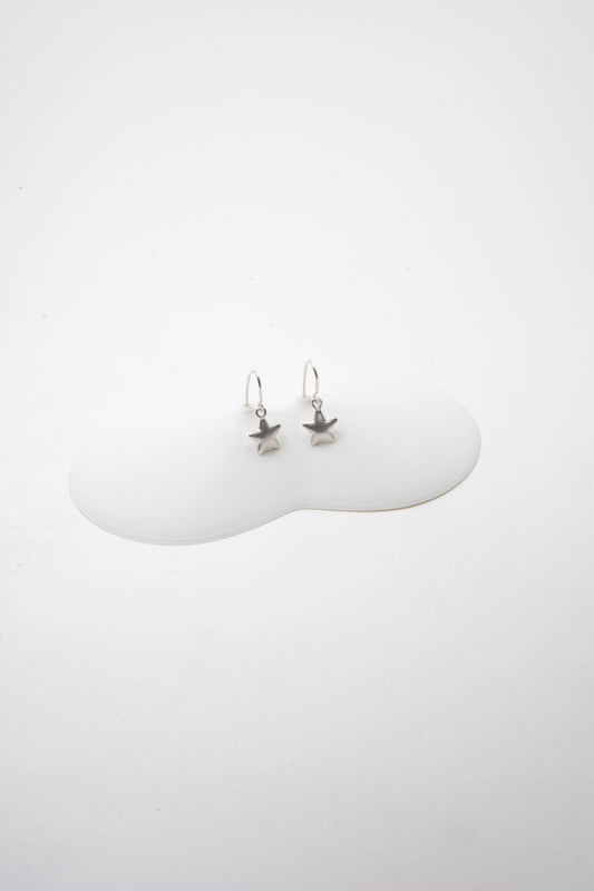 Solid sterling silver 925 star charm earrings handmade in Asheville, NC.