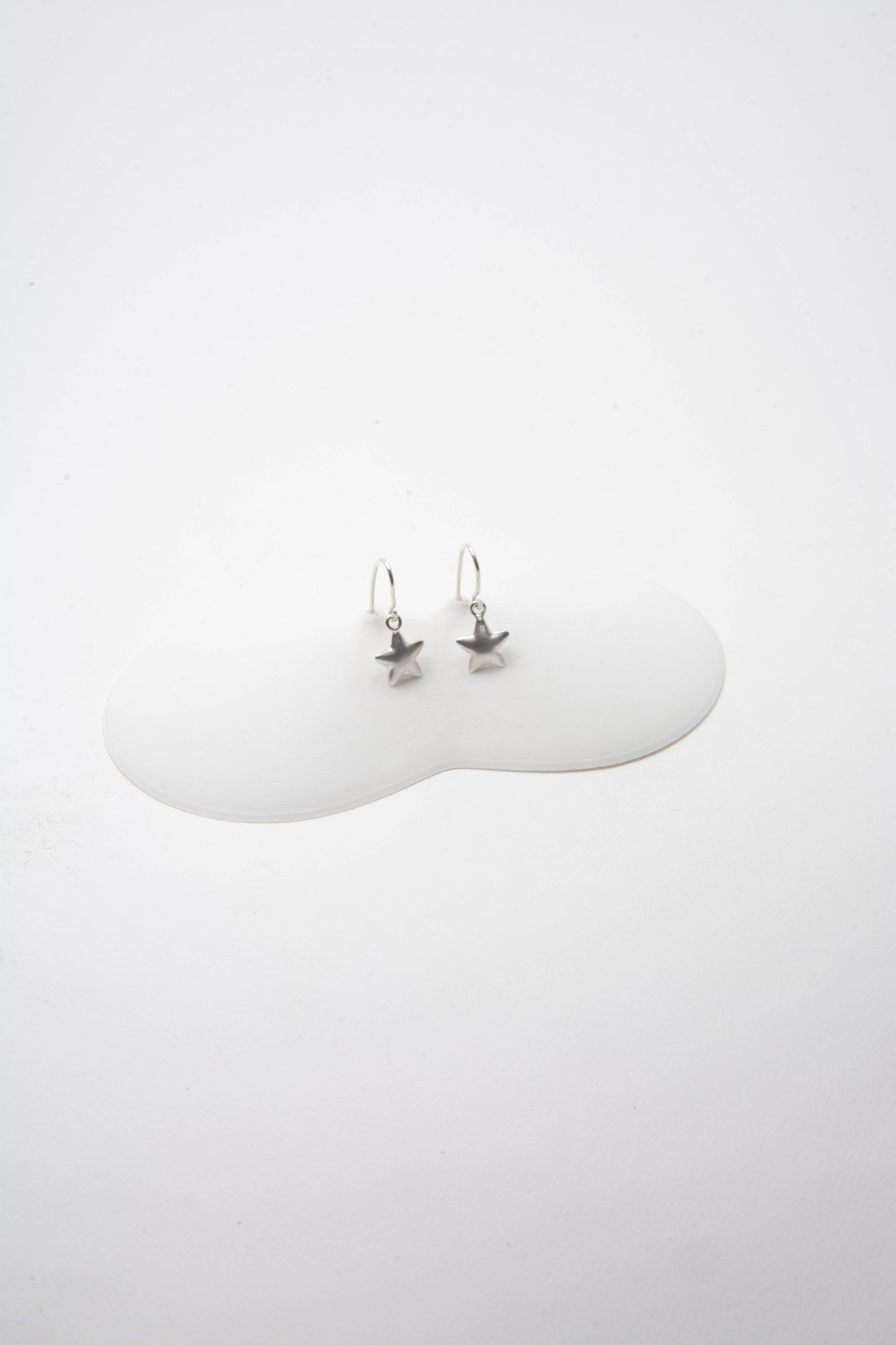 Solid sterling silver 925 star charm earrings handmade in Asheville, NC.