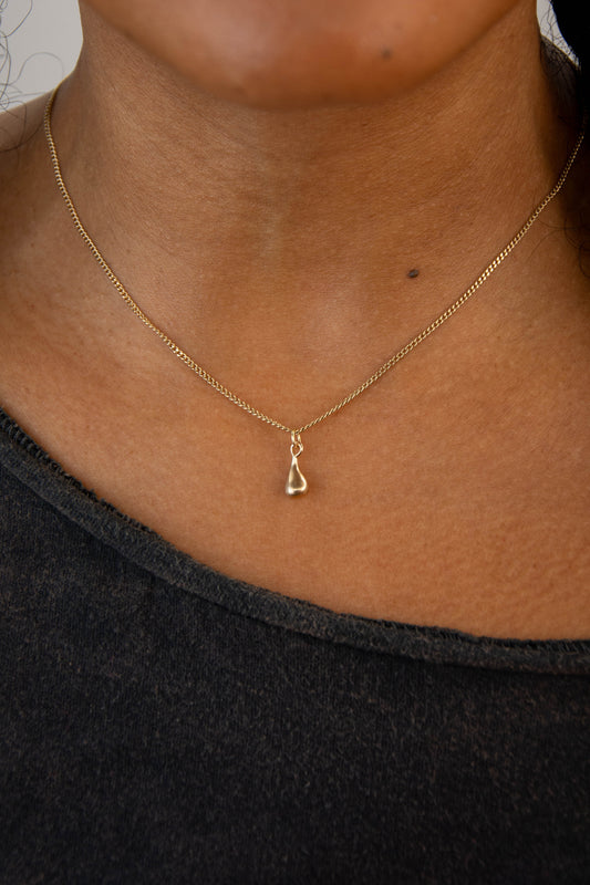 Solid 14k teardrop charm necklace handmade in Asheville, NC.