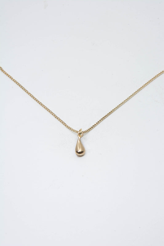 Solid 14k teardrop charm necklace handmade in Asheville, NC.