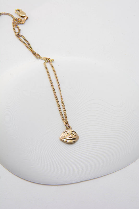 Solid 14k eye charm necklace handmade in Asheville, NC.