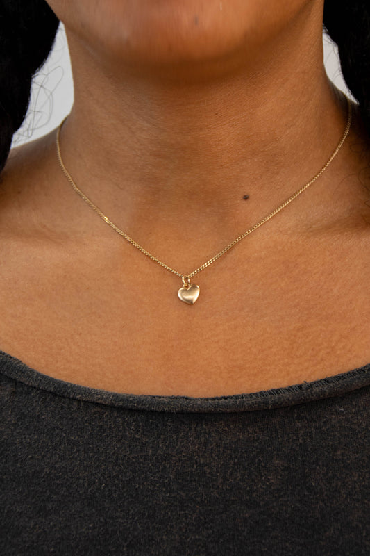 Solid 14k heart charm necklace handmade in Asheville, NC.