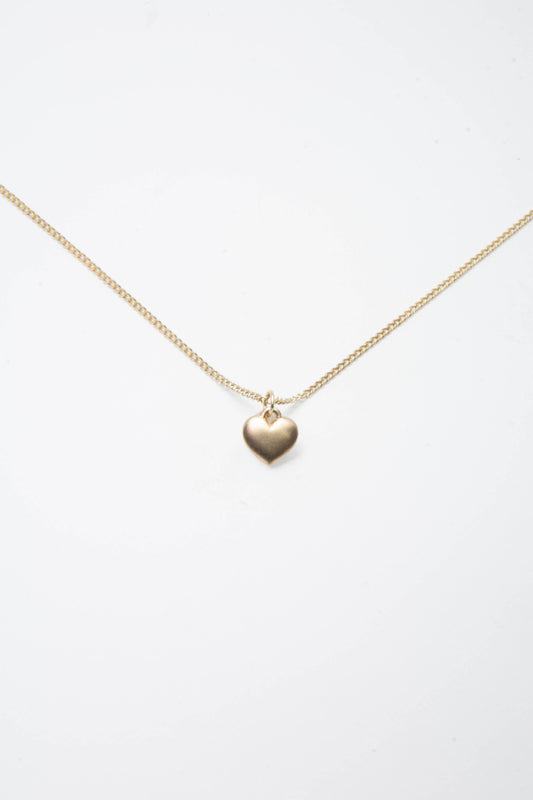 Solid 14k heart charm necklace handmade in Asheville, NC.
