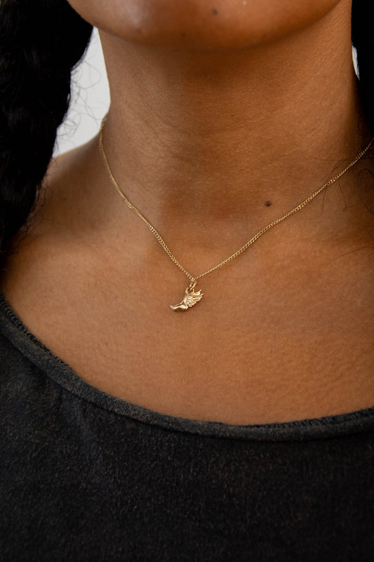 Solid 14k Hermes running foot charm necklace handmade in Asheville, NC.
