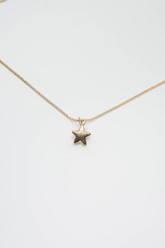 Solid 14k star charm necklace handmade in Asheville, NC.